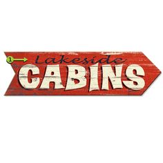 a wooden sign that says lakeside cabins with an arrow pointing to the right and left