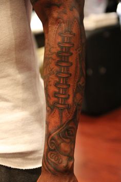 a man with a tattoo on his arm