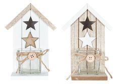 two small wooden houses with stars on the top and bottom one has a button in it