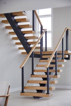 a wooden and metal staircase in a house