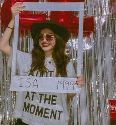 a woman holding up a sign that says it's a date at the moment