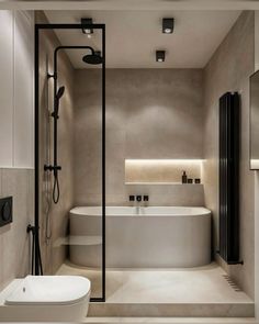 a bathroom with a bathtub, toilet and sink in it's center area