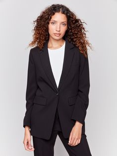 Black blazer featuring a ruched back detail, single button closure, and front flap pockets by Charlie B. Chic Suits With Pressed Crease For Career, Chic Solid Color Blazer For Business, Chic Solid Color Blazer For Business Casual, Sleek Semi-formal Notched Blazer, Chic Black Blazer With Pressed Crease, Chic Single Button Business Blazer, Chic Career Blazer With Notch Lapel, Chic Business Blazer With Hidden Button Closure, Chic Single Button Formal Blazer