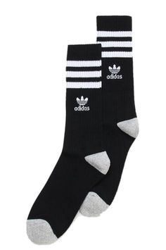 75% Recycled Polyester, 21% Polyester, 3% Rubber Imported Machine wash in cold with like colors. Tumble dry low. Non-chlorine bleach Three stripes wrap around the leg and finished with a classic logo on both sides of the leg. Soft acrylic yarn for extreme comfort. Cushioned footbed. Bin # 4 Black Crew Socks, Adidas Original, Youth Shoes, Classic Logo, Wrap Around, Acrylic Yarn, Crew Socks, Adidas Men, Bleach