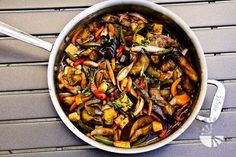 a pot filled with vegetables sitting on top of a table