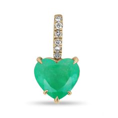 A fancy heart-shaped emerald and diamond accent bale necklace. This exquisite piece features an eye-catching heart-cut Colombian emerald that is 4.5 carats in size. The emerald showcases a vivacious medium-rich green color that can be seen from afar. Carefully pave set, six brilliant round cut diamonds highlight the bale. Crafted in gleaming 18K yellow gold. This piece comes with an 18-inch cable chain, as pictured.  Setting Style: Prong/Pave Setting Material: 18K Yellow Gold Main Stone: Emerald Shape: Heart Cut  Weight: 4.50-Carats Clarity: Semi-Transparent Color: Vivid Green Luster: Very Good Treatments: Natural, Oiling Origin: Colombia Secondary Stone: Diamond Weight: 0.15-Carats (Total) Cut: Brilliant Round Clarity: VS-SI Color: HI Luster: Excellent Treatments: Natural Estimated Retail Heart Cut Emerald Jewelry In Yellow Gold, Emerald Heart Charm Jewelry, Heart-shaped Emerald Jewelry For Valentine's Day, Heart-shaped Diamond Jewelry For May Birthstone, Valentine's Day Heart Shaped Emerald Jewelry, Fine Jewelry Heart Shaped May Birthstone, Fine Jewelry Heart-shaped May Birthstone, Elegant Heart-shaped Emerald Jewelry, Elegant Emerald Jewelry With Heart Charm