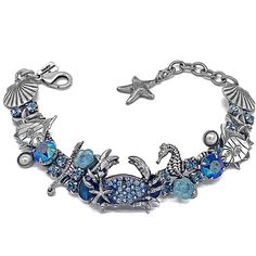 "Under the Sea blue crab bracelet....I had to create a blue crab since I am from Baltimore, Maryland! This is one of everyone 's favorite sea themed bracelet along with the sea turtle but then again the mermaids are amazingly popular Decisions decisions The bracelet is antique silver and set with mabe pearls and blue Abalone cabashons and accented in Capri blue aurora borealis and aqua Swarovski! Approximately measuring 7\" plus a 1&1/2\" extender with a starfish charm." Sea Turtle Bracelet, Blue Aurora, Owl Bracelet, Dragonfly Bracelet, Blue Aurora Borealis, Decisions Decisions, Turtle Bracelet, Hamsa Pendant, Fairy Jewelry