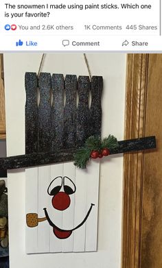 a door hanger with an image of a clown painted on it