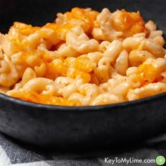 macaroni and cheese is being cooked in a skillet