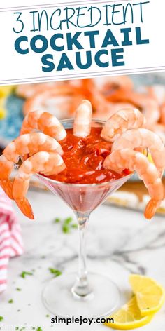 shrimp cocktail in a martini glass with lemon wedges and garnish on the side