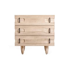 a wooden dresser with three drawers on one side and two small legs on the other