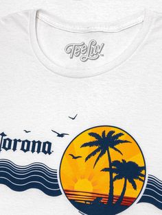 Vintage Never Looked So Good Corona wants you to "find your beach", but don't worry if you can't get away to a tropical destination! We've brought the coast a little closer to you with this vintage beer t-shirt featuring the authentic Corona logo, and an 80s-inspired tropical palm tree graphic complete with shorebirds. To complete the retro look and feel on this Corona shirt - we gave the entire graphic a fun, distressed and faded look and printed it on the highest quality, white cotton tee shir Graphic Tee T-shirt For Beach With Back Print, Graphic Tee T-shirt With Back Print For Beach, Graphic Tee With Back Print For Beach, Graphic Tee With Back Print For The Beach, Graphic Tee Tops With Back Print For Beach, Vintage Pre-shrunk T-shirt For Beach, Summer Beach Tops With Back Print, Palm Tree Graphic, Coastal Vibes