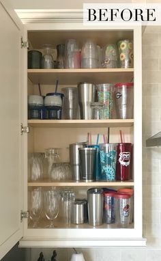 a kitchen cabinet filled with cups and glasses