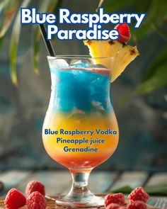 the blue raspberry paradise cocktail is garnished with pineapple