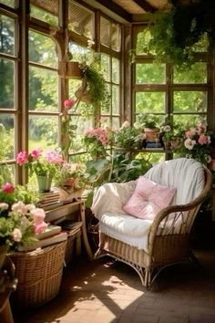 a sun room filled with lots of plants and flowers on the windows sills