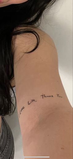 a woman with a tattoo on her arm that says live life, then it's