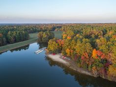 an aerial view of a lake surrounded by trees