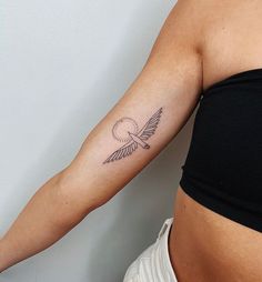 a woman with a small tattoo on her arm