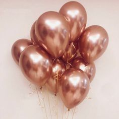 a bunch of balloons that are in the shape of heart shaped balloons on a white background