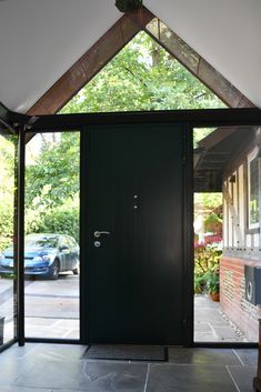 an open door leading to a parking lot