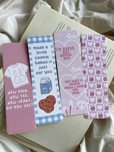 four bookmarks are laying on top of an open book, with the words made a little cute good if just for you