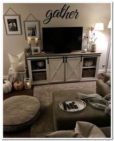 a living room filled with furniture and a flat screen tv on top of a wooden entertainment center