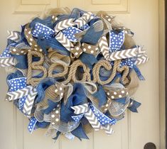 a wreath made out of burlocks and ribbons