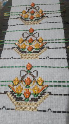 the table runner is decorated with colorful flowers