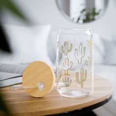 a glass jar sitting on top of a table next to a wooden paddle and mirror