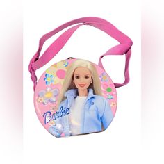 a barbie doll purse with a pink strap