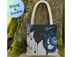 This abstract blue everyday bag, a creative gift for artists, doubles as a durable shopping tote--a versatile artistic carryall perfect for women, making it an ideal gift idea for a coworker seeking both style and functionality. 𝘿𝙀𝙏𝘼𝙄𝙇𝙎 (𝗦𝗽𝗹𝗮𝘀���𝗵 𝗼𝗳 𝗕𝗹𝘂𝗲 𝗧𝗼𝘁𝗲) ✦ Front and Back Printing ✦ Highly Durable ✦ Made with 100% polyester, a medium-weight fabric (6.49 oz/yd² (200 g/m ✦ Non-woven laminate inside ✦ Cotton handle ✦ Size tolerance 0.75" (1.9 cm) ✦ Boxed corners for more s Art Supply Bag, Idea For Art, Gift For Artist, Art Supplies Bag, Gift For Coworker, Carryall Tote, Custom Notebooks, Blue Tote, Art Supply