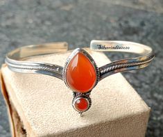 Carnelian Bangle, Carnelian Bracelet, 925 Sterling Silver Bangle, Handmade Bangle, Adjustable Bangle, Gemstone Bangle, Cuff Bangle Bracelet  Designer Carnelian Bangle, 925 Silver Bangle, Women Bangle, Handmade Bangle, Adjustable Bangle, Wedding Gift For Her, Silver Bracelet Jewelry --------------------------------------------------------------------------------------------------------------------------------------------------- Benefits Of Carnelian Stone := Carnelian was believed to provide confidence, endurance, belief, assertiveness, conviction, faith & self-assurance. It was also convicted to provide passion, love, intensity, eagerness, ardor, enthusiasm, commitment & vitality. Having Carnelian will also initiate the desires, wishes, hope, urge & empowerment. Occasion : Birthday Events, Adjustable Silver Carnelian Bracelets, Silver Carnelian Gemstone Bracelets, Silver Carnelian Bracelets As Gift, Silver Carnelian Bracelet As A Gift, Silver Carnelian Gemstone Bracelet, Silver Carnelian Bracelet Gift, Carnelian Bangle, Silver Bracelet Jewelry, Carnelian Bracelet