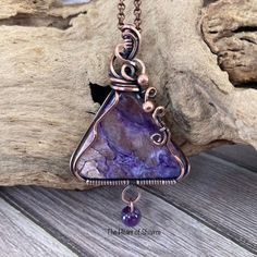 This gorgeous Charoite has shades of purple, brown, and white and is wrapped in oxidized copper wire. It has a dangle of Amethyst hanging at the bottom. It comes on a copper chain in a choice of lengths. CHAROITE is a stone of transformation. It is the soul stone that overcomes fear. Charoite stimulates inner vision and spiritual insight and aids in coping with enormous change at a spiritual level. To facilitate this, it synthesizes the heart and crown chakra's, cleanses the aura, and stimulates unconditional love. AMETHYST is extremely powerful and protective. It has a high spiritual vibration. Its serenity enhances higher states of consciousness. For meditation it turns mundane thoughts into tranquility and deeper understanding. Amethyst is one of the most spiritual stones, promoting lov Artisan Purple Wire Wrapped Jewelry, Artisan Purple Wire Wrapped Necklace, Unique Purple Copper Necklace, Hand Wrapped Purple Copper Jewelry, Hand Wrapped Purple Copper Wire Jewelry, Purple Wire Wrapped Copper Wire Necklace, Handmade Purple Copper Wire Necklace, Handmade Purple Necklace With Copper Wire, Hand Wrapped Purple Copper Necklace