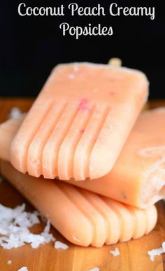 coconut peach creamy popsicles stacked on top of each other