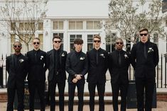 All Black Groomsmen, Groom In All Black, Famous Portrait Photographers, Black Groomsmen, Bridesmaids In White, Different Wedding Ideas, Foliage Decor, All Black Suit, Groomsmen Outfits