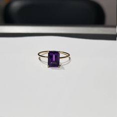 14k solid yellow gold natural AAA quality emerald cut rectangular shaped amethyst semi precious gemstone ring. 1. The weight of the natural amethyst gemstone used in the ring =1.50 cts. 2. The weight of the 14k solid yellow gold used in the ring =0.960 grms. 3. The amethysts is the birthstone for the people born in the month of February. 4. The ring is very nice and beautiful. 5. I have used all my skills and experience to manufacture this ring as beautiful as I can and I do hope that my work wi Natural Emerald, Amethyst Gemstone, Stackable Rings, Solid Yellow, Gemstone Ring, Emerald Cut, Semi Precious Gemstones, Beautiful Rings, Sapphire Ring