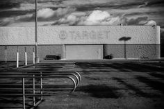 black and white photograph of an empty parking lot