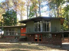 a house in the woods with lots of trees