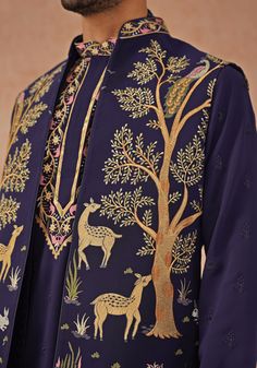 Step into sophistication with Navy Blue Jacket Kurta. Crafted from georgette, the jacket features exquisite resham and sequinned embroidery. This elegant ensemble includes a yoke design kurta, pure lining, and two pockets. Completed with an embroidered dupatta and matching pants. Perfect for special occasions like Sangeet, Mehendi, or as a wedding guest outfit. Composition : Jacket, Kurta & Trouser : Viscose Georgette Care: Dry Clean Only and Vacuum Storage This product can be customized for sle Kurta Set With Jacket, Design Kurta, Yoke Design, Vacuum Storage, Navy Blue Jacket, Indian Wedding Wear, Embroidered Dupatta, Matching Pants, Kurta Designs