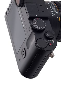 an image of a camera with its lens attached to the back of it's body