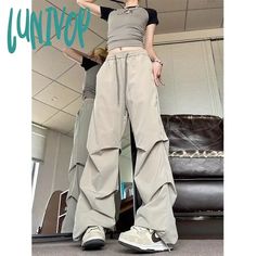 Lunivop Vintage Parachute Pants Women Black Baggy Y2k Streetwear Korean Fashion Pleated Cargo Trousers Harajuku 90s Aesthetic Kpop Season: All season Waist Type: high 1Measurement In CM size Waist(cm) Hips (cm) Pant Length(cm) M 64 90 101 L 66 92 102 XL 68 94 103 XXL 70 96 104 XXXL 72 98 105 1. The size is Asian size, smaller than US, UK, Australia, EU size. Please choose larger size or tell us your height and weight, and we suggest a suitable size for you. 2. The data is manually tiled measurem Parachute Pants Women, Kawaii Leg Warmers, Harajuku 90s, Streetwear Cargo Pants, Streetwear Korean, Summer Bodycon Dress, Baggy Y2k, 90s Aesthetic, Y2k Jeans