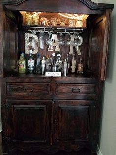 an old fashioned bar with bottles and glasses on it