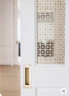 an open door with a decorative screen on it