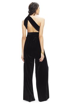 Our convertible Velvet Jumpsuit is perfect for the bridal party, rehearsal dinner, brunch, work and anywhere in between. It features our signature convertible wrap top and can be tied over 15 different ways. Two sizes fits all—size A fits US 0-12 and size B fits a US 14-24 Standard Length Measures 47" long. Please inquire about extra length options Fabric: Luxurious Poly-Spandex Velvet Care: Dry-Clean Only. Hang Dry. Steam Only, Do Not Iron Made in the USA Please see our FAQ for information on b Elegant Evening Jumpsuit With Tie Back, Chic Evening Jumpsuit With Tie Back, Evening Jumpsuits And Rompers With Tie Back, Bridesmaid Jumpsuit, Black Velvet Jumpsuit, Bridesmaids Jumpsuits, Casual Beach Wedding, Velvet Bridesmaid Dresses, Bridal Jumpsuit