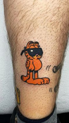 a man's leg with a cartoon character on it