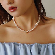 Enhance your elegance with our Simple Staggered Pearl Clavicle Necklace – a classic yet modern accessory that embodies sophistication. Crafted with precision and featuring an 18K gold-plated process, this necklace is a timeless addition to your collection. Materials: Copper Natural Pearl (4*7.5mm) The simple design, paired with staggered natural pearls, creates a chic and versatile necklace that effortlessly complements your style. Size: With a necklace circumference of 38-43cm, this piece is de Feminine White Pearl Chain Necklace, Chic Pearl Necklace With Pearl Charm, Feminine Pearl Drop Necklace, Feminine Pearl White Pearl Necklace, Classic Pearl White Necklace With Clavicle Chain, Delicate Pearl Necklace With Pearl Pendant, Delicate Pearl Necklace With Pendant, Elegant Cream Necklaces With Pearl Charm, White Pearl Drop Necklace In Feminine Style