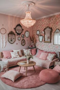 a living room filled with pink furniture and mirrors on the wall above it's coffee table