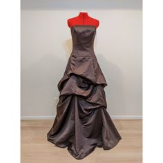 a brown dress on display in a room