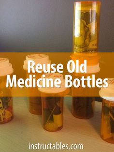 bottles filled with medicine sitting on top of a table