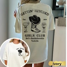 a woman wearing a t - shirt with the words gettin'hitched on it